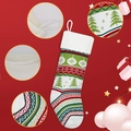 Detail showing knitted Christmas stocking hanging loop and holiday patterns on red fabric - Christmas Tree Pattern Style