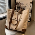 Grand sac cabas en toile beige avec détails en cuir marron et logo miduolai écrit - Blanc Cassé