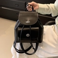 Elegant black faux leather mini backpack featuring silver turn-lock and drawstring closure - Black