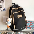 Mochila negra casual de gran capacidad para mujer con colgante de pato blanco y cremalleras - Negro Con Colgante