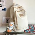 Mochila beige de gran capacidad con cremalleras marrones y colgante de pato mono - Blanco Con Colgante