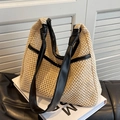Borsa tote in paglia intrecciata beige con manici in pelle nera e dettagli a nodo - Nero