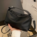 Classic black pebbled leather handbag with silver zipper and detachable shoulder strap - Black