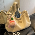 Off-white nylon dumpling bag with adjustable wide strap and cute pink charm - Khaki With Pendant