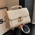 Chic cream-colored crossbody bag with textured leather finish and gold metal hardware - White