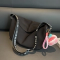 Black nylon saddle bag with wide logo strap and pink plush charm accessory - With Charm / Black