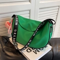 Bright green crescent saddle bag with black logo wide strap and pink peach charm - With Charm / Green