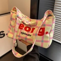 Borsa a tracolla in tela a scacchi gialli e rosa con grande capacità e scritte grafiche - Rosa