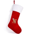 Red velvet Christmas stocking featuring a sequined letter N and a festive Santa hat detail - Style N