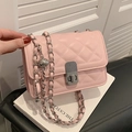 Pink quilted crossbody bag with silver twist lock and metallic chain strap detail - Pink