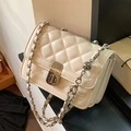 Beige quilted chain shoulder bag with metal turn-lock and leather-woven strap detail - White