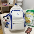White high school backpack with blue trim and cute plush dog pendant on white sofa - White Blue With Charm