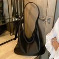 Large black pebbled leather hobo bag with wide shoulder strap for daily commute - Black