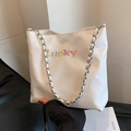 White Oxford tote bag for women featuring colorful Lucky embroidery and silver chain strap - White