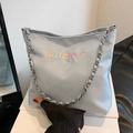 Light blue Oxford bucket bag with colorful Lucky embroidery and silver chain strap - Blue