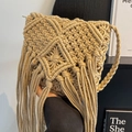 Handmade woven straw crossbody bag in khaki with bohemian tassels and braided strap - Universal Specification / Apricot