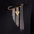 Golden safety pin brooch with heart charm and silver tassel chains on black suit - Gold and Silver Intertwined Heart Style (Gradient Gold 5560)