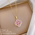 Detail of clover pendant with pink pear-cut crystals and white zircon stones on gold chain - Pink Clover Pendant Necklace (G314)