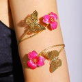 Detail of gold arm cuff with hollow butterflies and rose pink enamel flower accents - Rose Red Butterfly Flower Style (DZ-351)