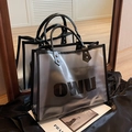 Black trimmed frosted transparent jelly tote bag with OWU lettering and top handle - Clear