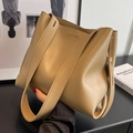 Large khaki leather bucket bag with wide shoulder straps for a minimalist commute style - Khaki