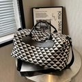 Large travel tote with black and white geometric triangle patterns and leather handles - Black
