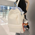 Creamy white, blue, and red patchwork backpack with a cute cow plush pendant charm - Black without Pendant