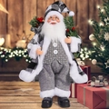 Macro view of Santa Claus figurine showing black and white plaid suit and fuzzy white trim - Black and White Plaid Santa Claus