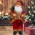 Detailed Santa Claus figurine with red plaid robe holding a vintage lantern and gift bag - Red and Gold Santa Claus