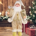 Detailed champagne gold Santa Claus figurine with sequins and plush trim by Christmas tree - Gold Santa Claus