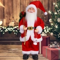 Detail of 12-inch Santa Claus figurine with lantern and gift bag in festive home setting - Red Santa Claus
