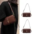 Vintage brown leather crossbody bag with elegant gold U-shaped buckle and slim strap - Coffee