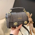 Deep grey leather handbag with gold twist lock and cute knitted rabbit charm - Black With Pendant