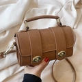 Brown cross-grain leather crossbody bag with dual gold twist locks and top handle - Brown Without Pendant