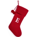 Red knit Christmas stocking with white letter E patch and hanging plush pompoms - Red Letter E