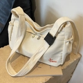 Off-white große Canvas-Tragetasche mit roter Stickerei und Tunnelzug-Seitentasche - Cremeweiß