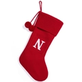 Red knit Christmas stocking featuring white letter N and fluffy pom poms - Red Letter N