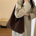 Large dark brown frosted leather tote bag with wide shoulder strap in minimalist style - Black