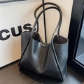 Large black tote bag with unique pleated texture and integrated shoulder straps - Black