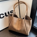 Brown leather large capacity tote bag with dual handles and unique vertical stitching - Tan