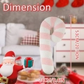 Pink and white striped candy cane pillow dimensions showing 53cm height in cozy setting - Large Candy Cane