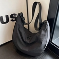 Minimalist black nylon crescent crossbody bag with adjustable wide fabric strap - S / Black