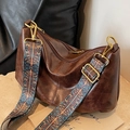 Retro brown leather hobo bag with a wide ethnic style patterned shoulder strap - Brown