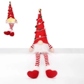 Illuminated Christmas gnome with long red legs and gold bell on a minimalist white stage - Long Leg Red Christmas Hat