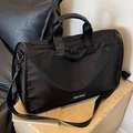 Black nylon large capacity commuter pillow bag with adjustable shoulder strap and leather trim - Black