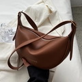 Brown half-moon crossbody bag with litchi texture and gold hardware on white background - No Pendant / Brown