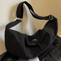 Large black nylon crescent crossbody bag with wide adjustable strap and dual zippers - Black