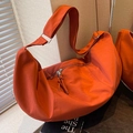 Terracotta oversized crescent canvas crossbody bag with adjustable wide strap and fringe detail - Orange