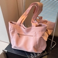 Pink canvas tote bag with multi-pocket design and long shoulder straps for daily use - Pink