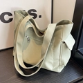Light green large capacity canvas tote bag with side pockets and wide shoulder straps - Green